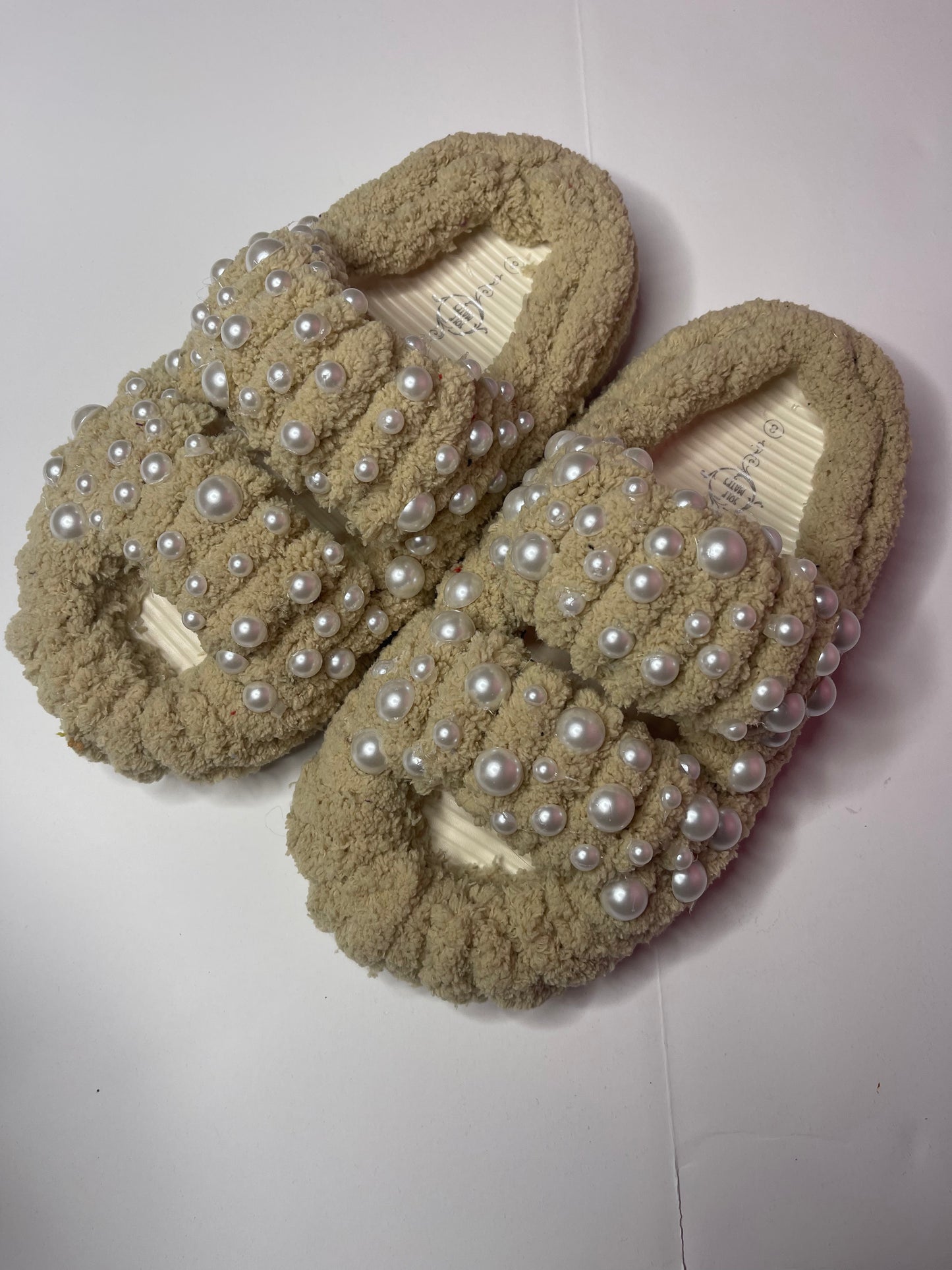 "Cozy ivory yarn slippers for women, a stylish and thoughtful holiday gift idea."
