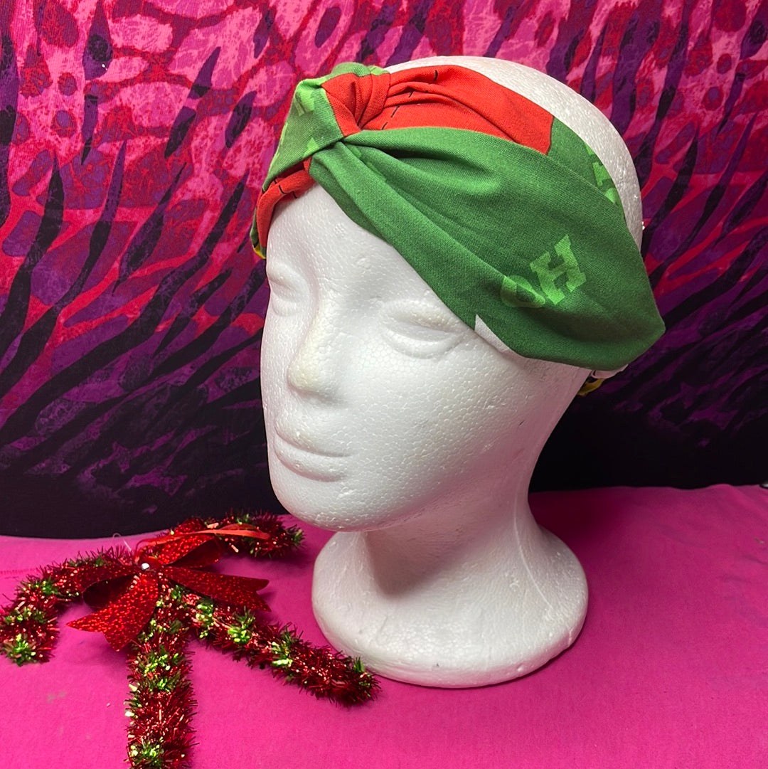 Grinch Turban Twist Headband with festive green and red design.